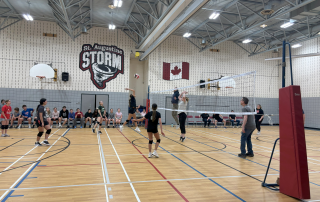 Students versus Teachers volleyball game at St. Augustine