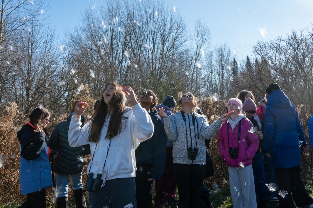 Students with milkweed seeds