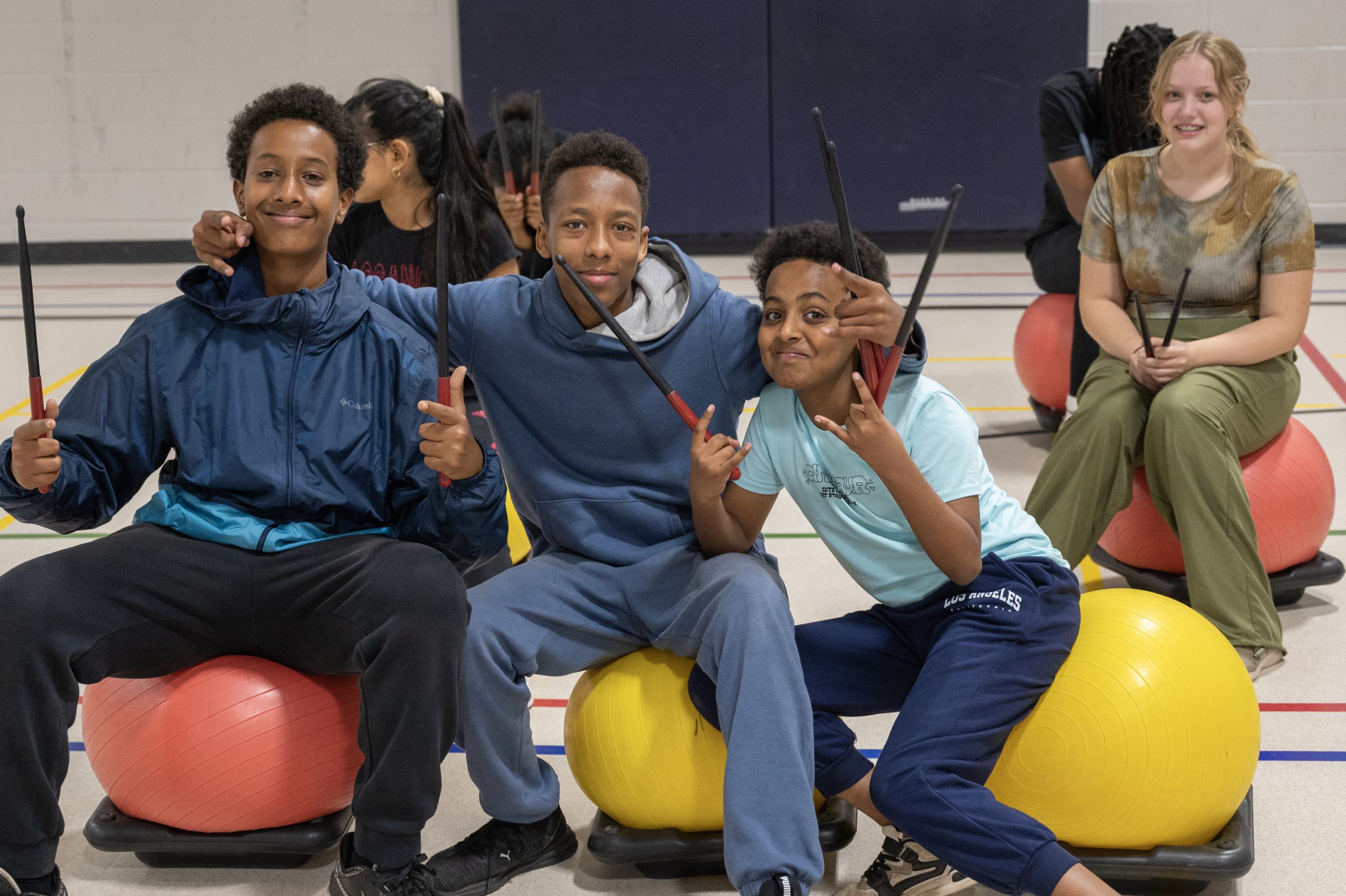 Students in the gym for a drumming session