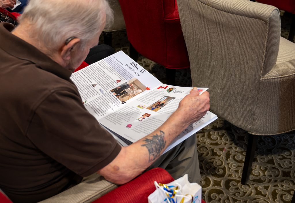 Resident reading his story