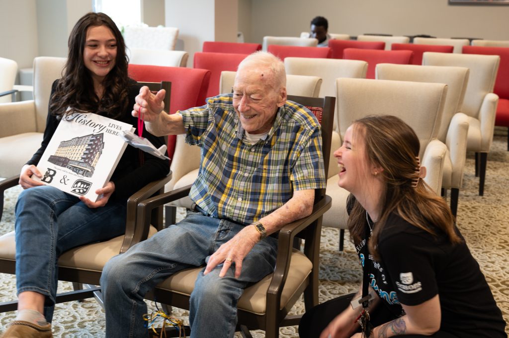 Student with friend and staff