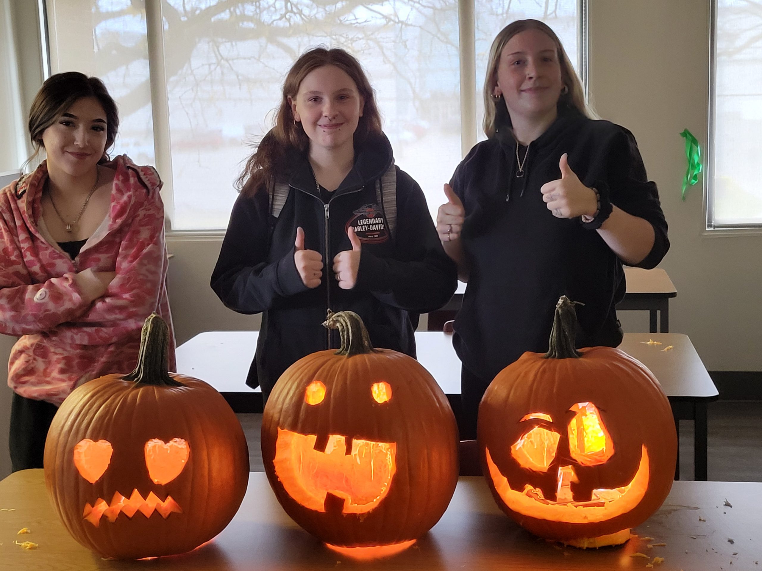 St. Don Bosco students carving pumpkins